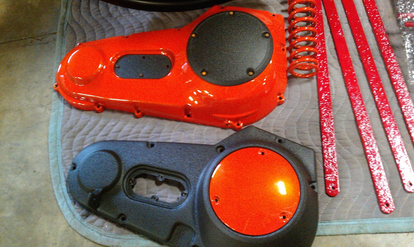 black and red powder coated engine cover pieces